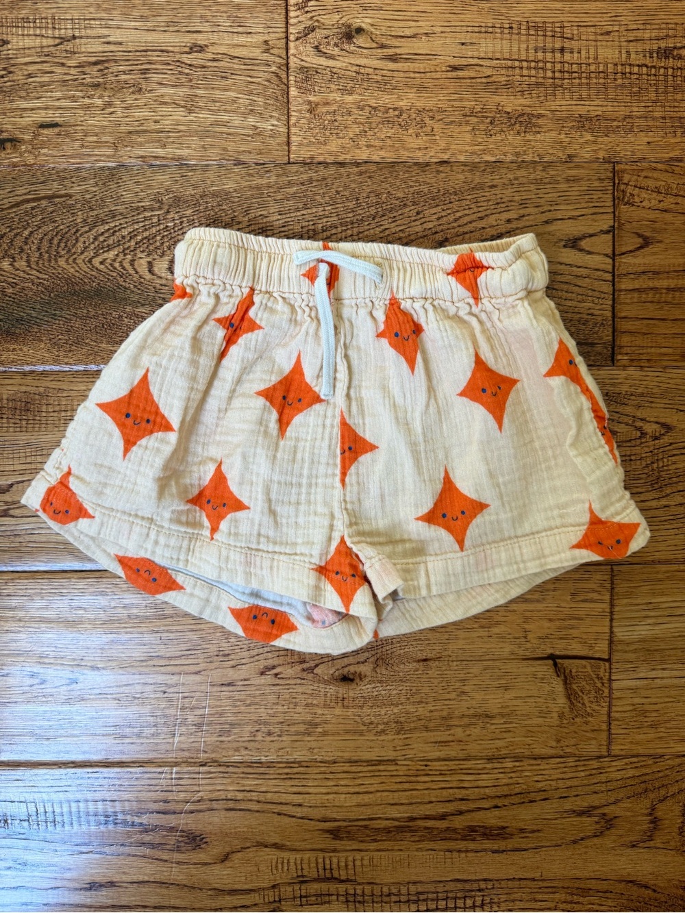Tiny Cottons Kids Cream Sparkle Shorts with Orange Star Print